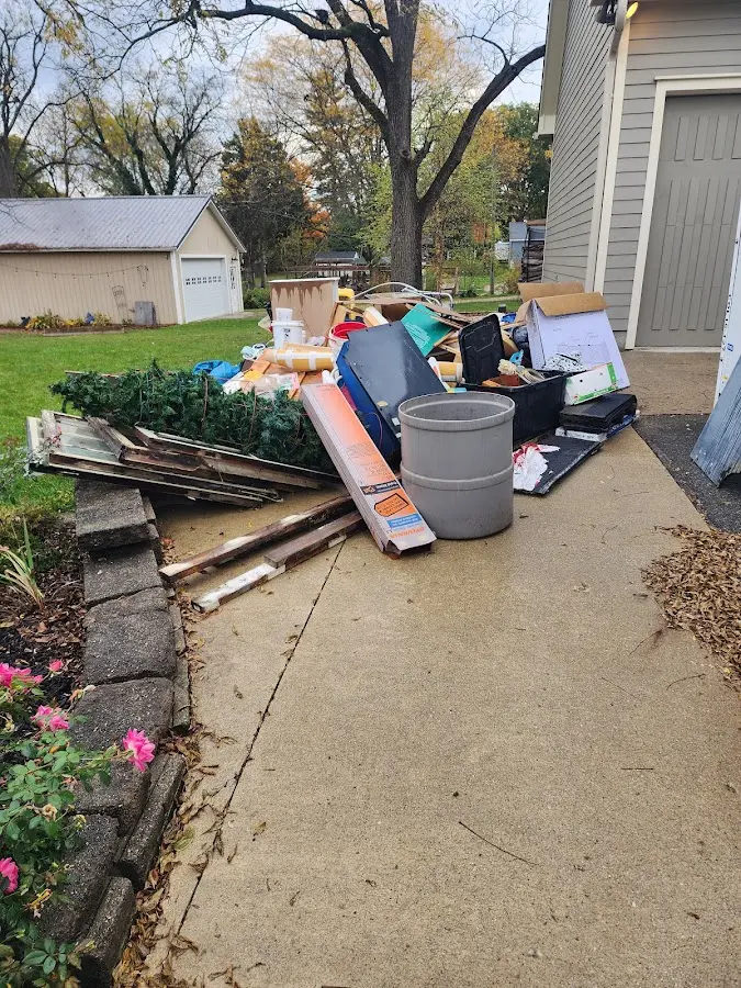 Dumpster being loaded with debris for Commercial Dumpster Rental in Vergennes